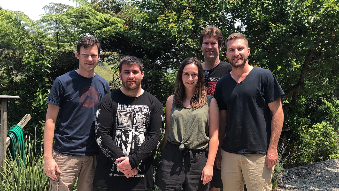 Photo of the Springtimesoft team members standing in front of trees.